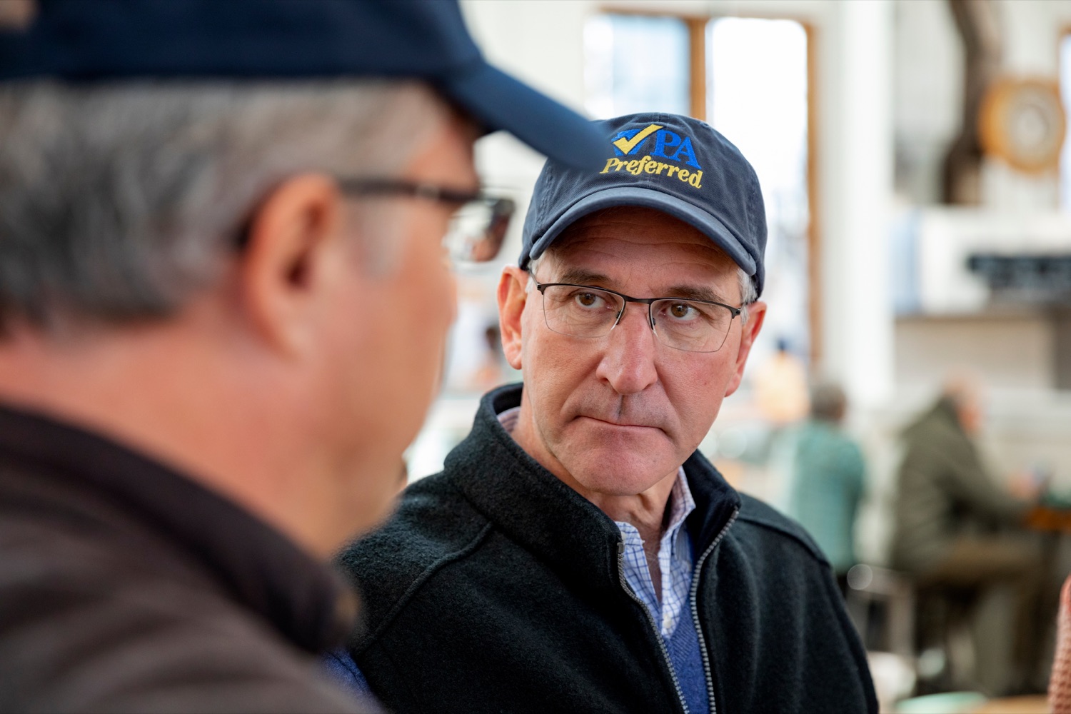 Pennsylvania Department of Agriculture Secretary Russell Redding talks with Mark Zimmerman, owner of Revittle Market, while grocery shopping for Thanksgiving dinner inside Broad Street Market on Thursday, November 21, 2019.<br><a href="https://filesource.amperwave.net/commonwealthofpa/photo/17546_AGRIC_Buy_Local_NK_010.JPG" target="_blank">⇣ Download Photo</a>