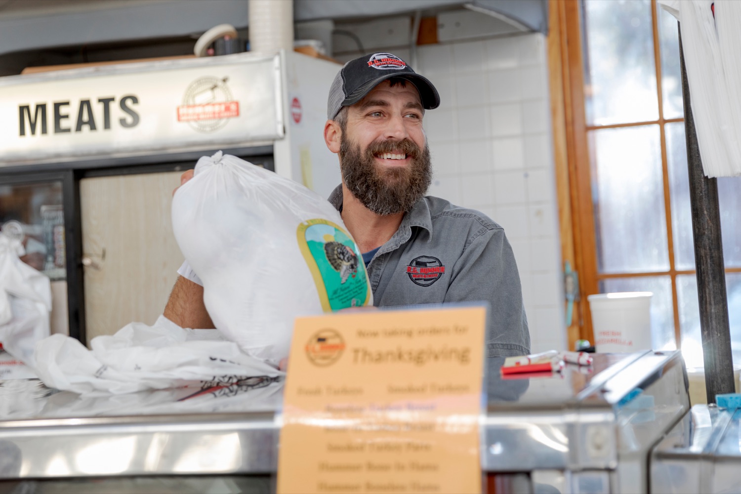 Ryan Hummer, owner of R.G. Hummer Meat & Cheese, inside Broad Street Market on Thursday, November 21, 2019.<br><a href="https://filesource.amperwave.net/commonwealthofpa/photo/17546_AGRIC_Buy_Local_NK_018.JPG" target="_blank">⇣ Download Photo</a>