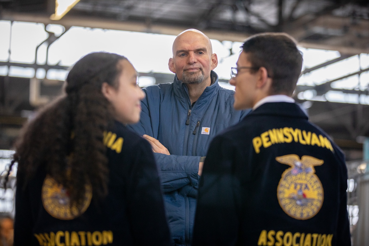 Lt. Governor John Fetterman speaking to Pennsylvania FFA members.  Lt. Governor John Fetterman and Secretary of Agriculture Russell Redding today unveiled the 2020 Pennsylvania Farm Show butter sculpture, carved from a half-ton of butter depicting three of Pennsylvanias beloved professional sports mascots: Philadelphia Flyers Gritty, Philadelphia Eagles Swoop, and Pittsburgh Steelers Steely McBeam celebrating with a spread of Pennsylvania dairy products. The sculpture, a long-time Farm Show staple, encourages Pennsylvanians to be a fan of Pennsylvania dairy and give a cheer to the more than 6,200 dairy farmers in the commonwealth.  Harrisburg, PA  January 2, 2020<br><a href="https://filesource.amperwave.net/commonwealthofpa/photo/17646_agric_butter_sculpture_dz_013.jpg" target="_blank">⇣ Download Photo</a>