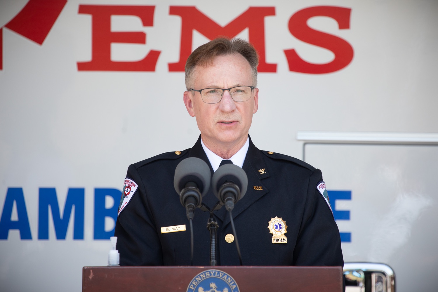 Bob May, Executive Director Lancaster EMS speaking to the press.  Governor Tom Wolf visited the Millersville location of Lancaster EMS today to thank first responders and learn about how they are adapting their critical work during the states response to the COVID-19 pandemic.  Millersville, PA  July 30, 2020<br><a href="https://filesource.amperwave.net/commonwealthofpa/photo/18180_gov_first_responders_dz_013.jpg" target="_blank">⇣ Download Photo</a>