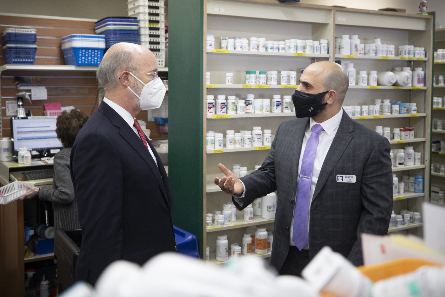 Alex Quaddoumi, R.Ph, Pharmacist, See-Right Pharmacy and Pennsylvania Governor Tom Wolf speaking in the pharmacy. Governor Tom Wolf today visited See-Right Pharmacy in Harrisburg to learn more about how the local, neighborhood pharmacy is vaccinating community members and to talk about COVID-19 vaccine hesitancy in Pennsylvania. Harrisburg, PA  April 22, 2021<br><a href="https://filesource.amperwave.net/commonwealthofpa/photo/18704_gov_seeRight_dz_003.jpg" target="_blank">⇣ Download Photo</a>