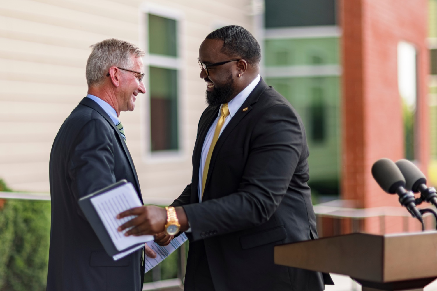 PA Dept. of Agriculture Secretary Russell Redding shakes hands with Stephon Fitzpatrick, executive director of Pennsylvania commission for Agriculture Education Excellence, during a press conference, which highlighted the success of Pennsylvania's farm to school programs, at Hill Top Academy in Mechanicsburg on Friday, August 27, 2021.<br><a href="https://filesource.amperwave.net/commonwealthofpa/photo/19054_AGRIC_FarmToSchool_NK_004.jpg" target="_blank">⇣ Download Photo</a>