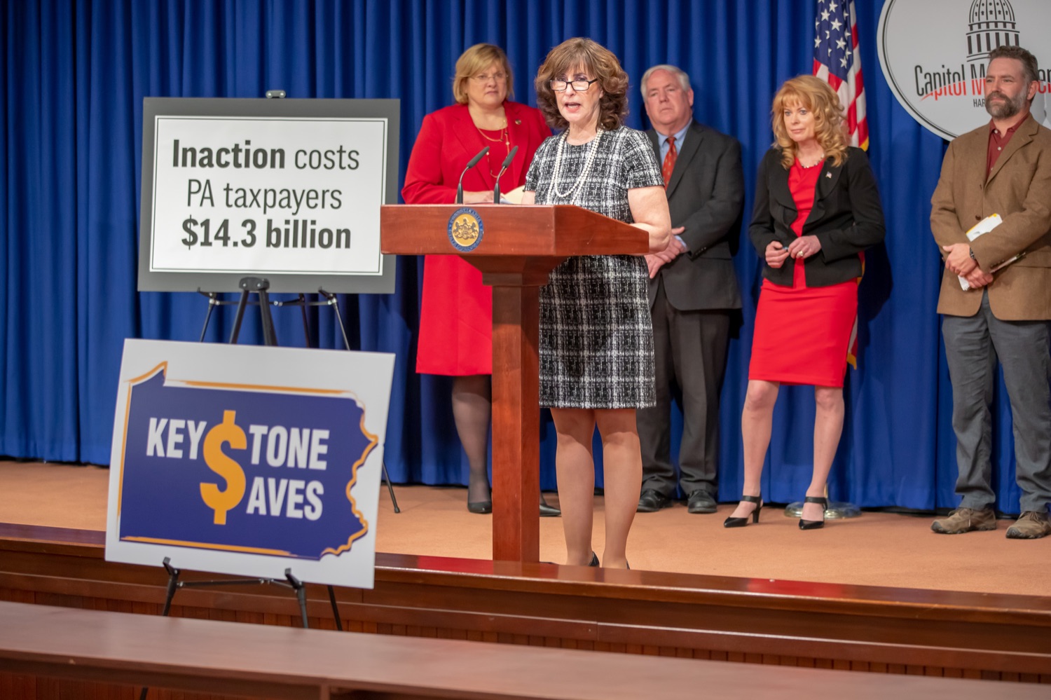 Joanne Grossi, AARP Pennsylvania State President, speaks during Mondays press conference.  Treasurer Stacy Garrity, along with Rep. Tracy Pennycuick and Rep. Driscoll announced the upcoming introduction of a bill to create Keystone Saves, a retirement savings program for hardworking Pennsylvanians who do not have access to retirement savings through their employer.  They were joined at the announcement by supporters in the General Assembly and representatives of AARP, the United Way of Pennsylvania, the Pennsylvania Health Care Association, and the Pennsylvania Association of Sustainable Agriculture. Other supporters of Keystone Saves include The Pew Charitable Trusts and the Pennsylvania Institute of CPAs. Harrisburg, PA - December 12, 2021<br><a href="https://filesource.amperwave.net/commonwealthofpa/photo/20293_TREAS_KeystoneSaves_AG_09.jpg" target="_blank">⇣ Download Photo</a>