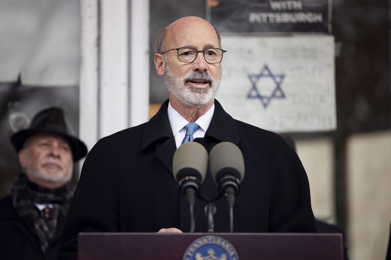 Pennsylvania Governor Tom Wolf speaking with the press.  Governor Tom Wolf visited the Tree of Life in Pittsburgh today to announce $6.6 million in state funding to support the rebuilding and reimagining of the synagogue. The governor was joined by Rabbi Jeffrey Myers, Senate Democratic Leader Jay Costa and members of the Tree of Lifes REMEMBER. REBUILD. RENEW campaign which will transform the site of the worst antisemitic attack in U.S. history into a new place of hope, remembrance, and education. Pittsburgh, PA - December 6, 2021<br><a href="https://filesource.amperwave.net/commonwealthofpa/photo/20308_gov_treeOfLife_dz_007_copy.jpg" target="_blank">⇣ Download Photo</a>