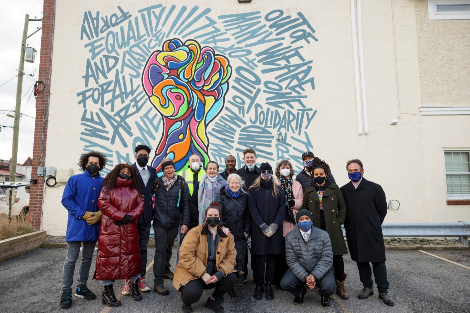 People pose in front of a mural during an event observing the "Day of Racial Healing" in Pennsylvania at Jenkintown Town Square on Tuesday, January 18, 2022. By proclamation of Governor Tom Wolf, Pennsylvania joined communities across the United States in mobilizing events and activities that support bringing racial healing into homes, communities, and institutions. This is a call to action to work together and heal the wounds of racial bias and commit to building an equitable and just society so that all residents can thrive.<br><a href="https://filesource.amperwave.net/commonwealthofpa/photo/20315_OAR_RacialHealing_NK_001.JPG" target="_blank">⇣ Download Photo</a>