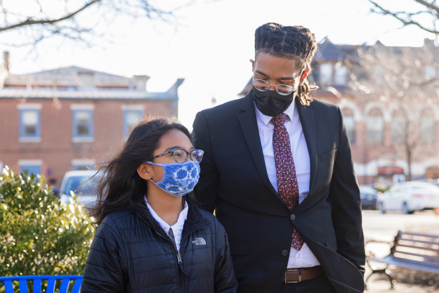 Victor Cabral, Office of Advocacy and Reform deputy director, with his 9-year-old daughter, Bella, during an event observing the "Day of Racial Healing" in Pennsylvania at Jenkintown Town Square on Tuesday, January 18, 2022. By proclamation of Governor Tom Wolf, Pennsylvania joined communities across the United States in mobilizing events and activities that support bringing racial healing into homes, communities, and institutions. This is a call to action to work together and heal the wounds of racial bias and commit to building an equitable and just society so that all residents can thrive.<br><a href="https://filesource.amperwave.net/commonwealthofpa/photo/20315_OAR_RacialHealing_NK_004.JPG" target="_blank">⇣ Download Photo</a>