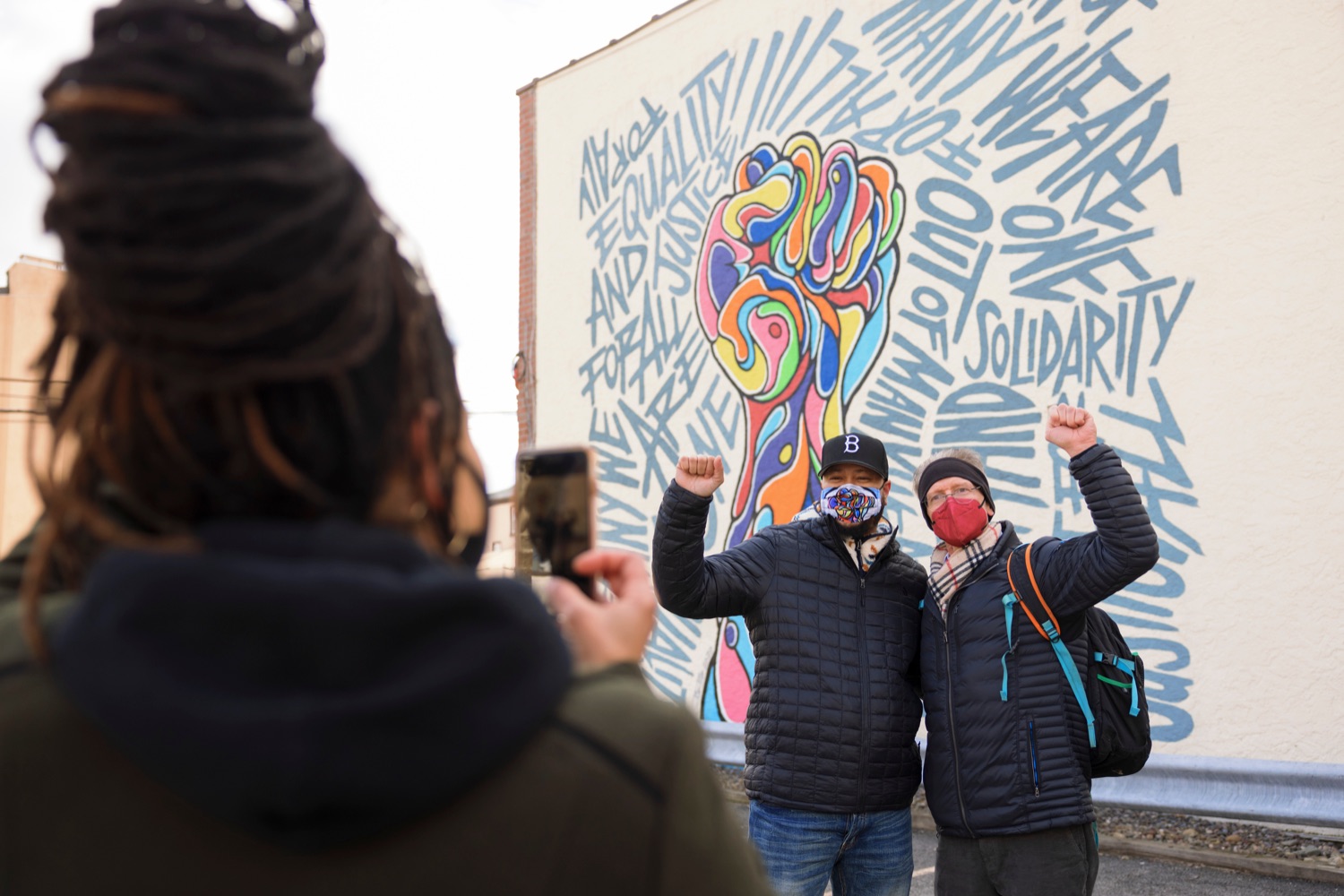 Muralist Brian Bowens, left, poses for a picture in front of his mural with poet Dr. Jeffrey Tietbohl during an event observing the "Day of Racial Healing" in Pennsylvania at Jenkintown Town Square on Tuesday, January 18, 2022. By proclamation of Governor Tom Wolf, Pennsylvania joined communities across the United States in mobilizing events and activities that support bringing racial healing into homes, communities, and institutions. This is a call to action to work together and heal the wounds of racial bias and commit to building an equitable and just society so that all residents can thrive.<br><a href="https://filesource.amperwave.net/commonwealthofpa/photo/20315_OAR_RacialHealing_NK_009.JPG" target="_blank">⇣ Download Photo</a>