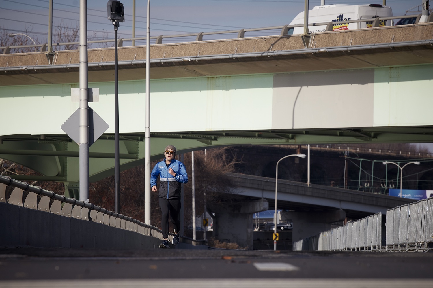A runner on the damaged Martin Luther King Jr Dr. Bridge, which has been closed to vehicular traffic.  Governor Tom Wolf stood alongside U.S. Transportation Secretary Pete Buttigieg to launch the largest bridge formula program in American history, made possible by the passage of the Bipartisan Infrastructure Law. Pennsylvania is set to receive $1.6 billion to fix more than 3,000 bridges across the commonwealth.  Philadelphia, PA  January 14, 2021<br><a href="https://filesource.amperwave.net/commonwealthofpa/photo/20426_gov_bridgeAnnoucement_dz_012_copy.jpg" target="_blank">⇣ Download Photo</a>