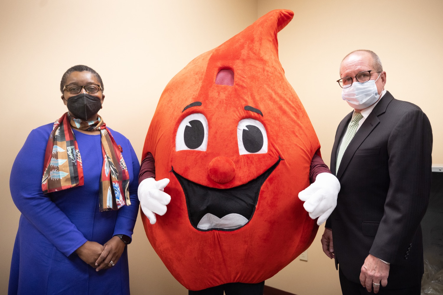 Physician General Dr. Denise A. Johnson with Patrick Bradley, President / CEO at Central Pennsylvania Blood Bank and the Central Pennsylvania Blood Bank mascot.  Pennsylvania Physician General Dr. Denise Johnson and Patrick Bradley, President and CEO of the Central Pennsylvania Blood Bank, expressed their growing concern over the dramatically decreasing number of volunteers who regularly donate blood, during a news conference highlighting the critical need for blood donation across the commonwealth.  February 03, 2022 - Hummelstown, Pa<br><a href="https://filesource.amperwave.net/commonwealthofpa/photo/20488_doh_bloodShortage_dz_020.jpg" target="_blank">⇣ Download Photo</a>