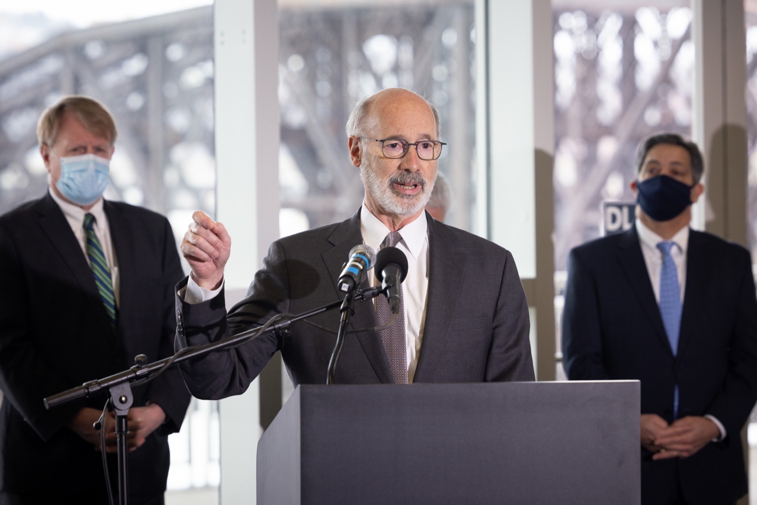 Pennsylvania Governor Tom Wolf speaks with the press.  Governor Tom Wolf and Pennsylvania Department of Transportation (PennDOT) Deputy Secretary for Multimodal Transportation Jennie Louwerse were joined by Federal Railroad Administration Administrator Amit Bose, Norfolk Southern (NS) Regional Vice President Rudy Husband and local officials today to announce that the federal Bipartisan Infrastructure Law (BIL) has paved the way for movement toward improved freight and passenger-rail service between Harrisburg and Pittsburgh. Pittsburgh, PA  February 18, 2022<br><a href="https://filesource.amperwave.net/commonwealthofpa/photo/20547_gov_infrastructure_dz_011.jpg" target="_blank">⇣ Download Photo</a>