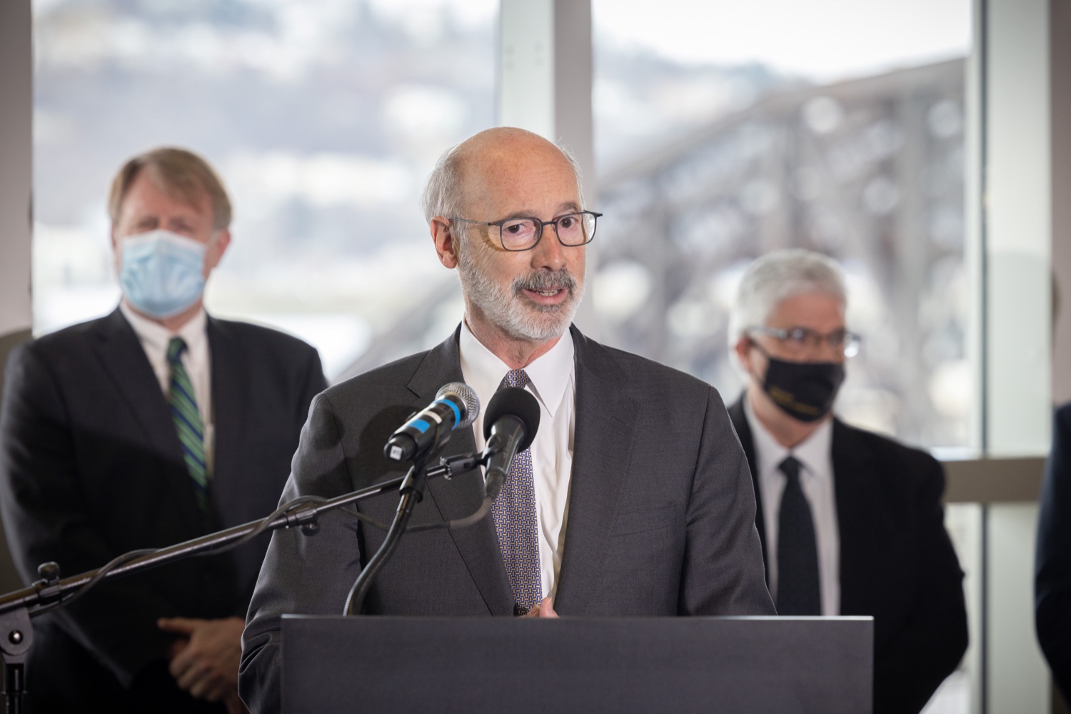 Pennsylvania Governor Tom Wolf speaks with the press.  Governor Tom Wolf and Pennsylvania Department of Transportation (PennDOT) Deputy Secretary for Multimodal Transportation Jennie Louwerse were joined by Federal Railroad Administration Administrator Amit Bose, Norfolk Southern (NS) Regional Vice President Rudy Husband and local officials today to announce that the federal Bipartisan Infrastructure Law (BIL) has paved the way for movement toward improved freight and passenger-rail service between Harrisburg and Pittsburgh. Pittsburgh, PA  February 18, 2022<br><a href="https://filesource.amperwave.net/commonwealthofpa/photo/20547_gov_infrastructure_dz_015.jpg" target="_blank">⇣ Download Photo</a>