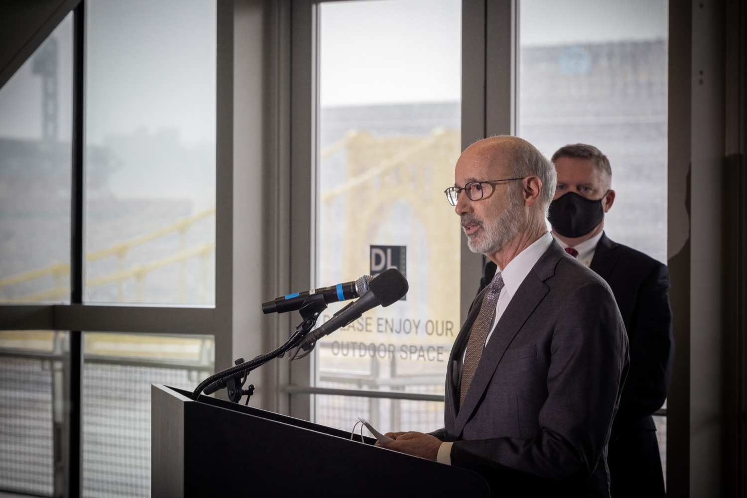 Pennsylvania Governor Tom Wolf speaks with the press.  Governor Tom Wolf and Pennsylvania Department of Transportation (PennDOT) Deputy Secretary for Multimodal Transportation Jennie Louwerse were joined by Federal Railroad Administration Administrator Amit Bose, Norfolk Southern (NS) Regional Vice President Rudy Husband and local officials today to announce that the federal Bipartisan Infrastructure Law (BIL) has paved the way for movement toward improved freight and passenger-rail service between Harrisburg and Pittsburgh. Pittsburgh, PA  February 18, 2022<br><a href="https://filesource.amperwave.net/commonwealthofpa/photo/20547_gov_infrastructure_dz_019.jpg" target="_blank">⇣ Download Photo</a>