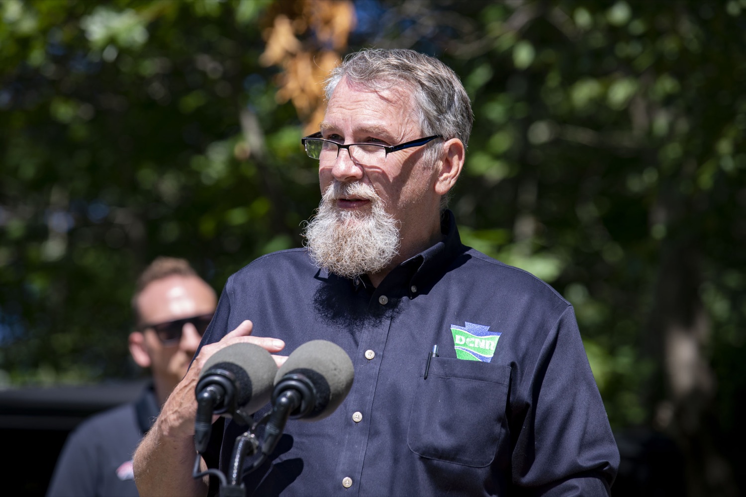 DCNR Deputy Secretary John Norbeck discusses the acquisition of a 5,600-acre tract of land that will be developed into a new motorized recreation area, in McAdoo, PA on August 12, 2022.<br><a href="https://filesource.amperwave.net/commonwealthofpa/photo/22090_dcnr_RecreationArea_18.jpg" target="_blank">⇣ Download Photo</a>