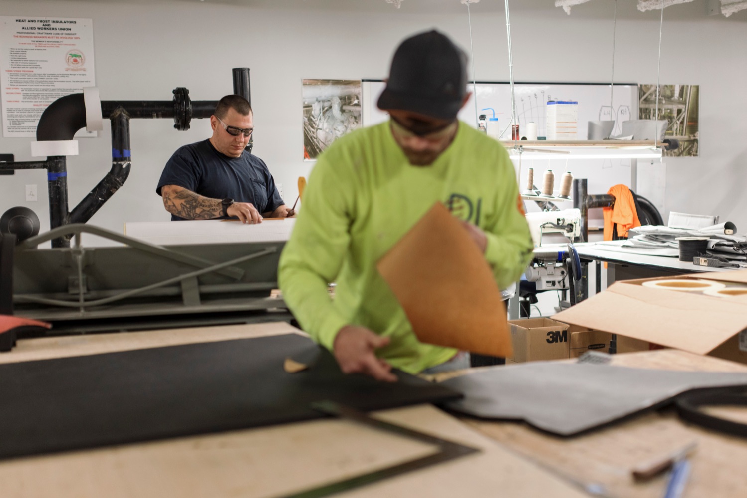William Youmans, 27, left, and Jesse Welk, 27, work on layouts for pipe insulation following a press conference which kicked off National Apprenticeship Week with a visit to Heat and Frost Insulators Local 23, a training center in Dauphin County, on Monday, November 14, 2022. National Apprenticeship Week (NAW) is a nationwide celebration for industry, labor, equity, workforce, education and government leaders to showcase the successes and value of registered apprenticeship for building our economy, advancing racial and gender equity, and supporting underserved communities.<br><a href="https://filesource.amperwave.net/commonwealthofpa/photo/22344_li_apprenticeshipweek_NK_017.JPG" target="_blank">⇣ Download Photo</a>