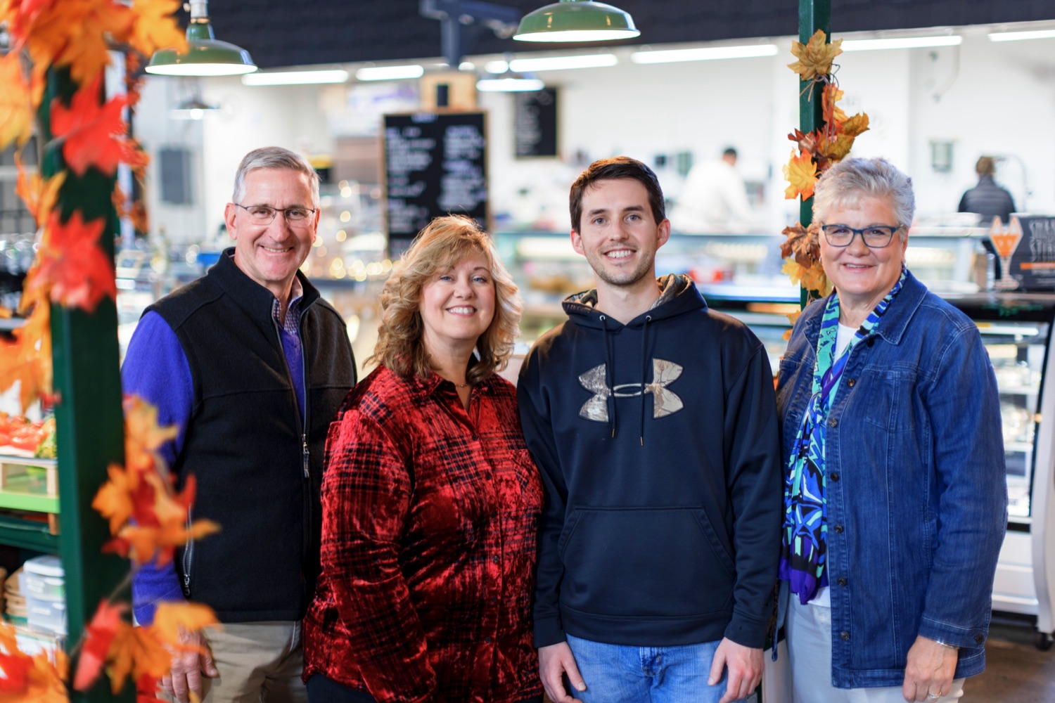 Agriculture Secretary Russell Redding, left, and First Lady of Agriculture Nina Redding, right, pose for a picture with Barb Fitz and her son, Isaac, at their produce stand, Dennis Fitz Produce, inside York Central Market House on Thursday, November 17, 2022.<br><a href="https://filesource.amperwave.net/commonwealthofpa/photo/22347_AG_Thanksgiving_Shopping_NK_018.JPG" target="_blank">⇣ Download Photo</a>