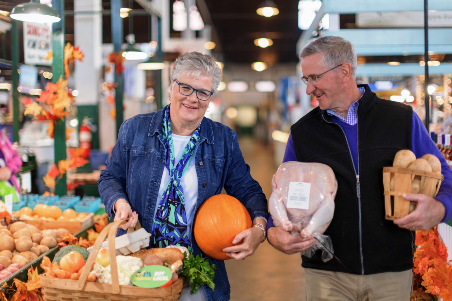 Agriculture Secretary Russell Redding and First Lady of Agriculture Nina Redding hold their PA Preferred® ingredients for their family Thanksgiving celebration at York Central Market House on Thursday, November 17, 2022.<br><a href="https://filesource.amperwave.net/commonwealthofpa/photo/22347_AG_Thanksgiving_Shopping_NK_023.JPG" target="_blank">⇣ Download Photo</a>
