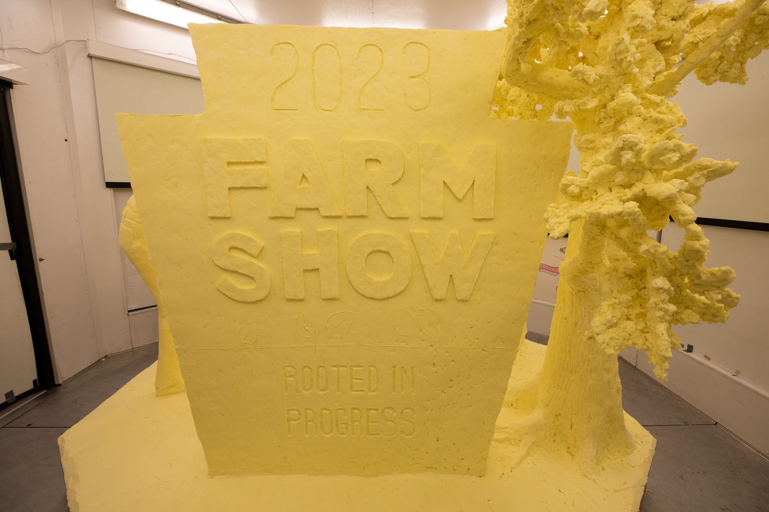 Secretary of Agriculture Russell Redding unveiled the 2023 Pennsylvania Farm Show butter sculpture. Carved from 1,000 pounds of butter, it highlights this years theme: Rooted in Progress. ..We celebrate this years theme, Rooted in Progress, by highlighting the progress made over the past eight years and the opportunity that Pennsylvanias farm families have today to innovate, diversify, and plan, said Redding. The entire commonwealth benefits from the strong roots weve cultivated for agriculture. These roots feed local economies and Pennsylvania families, they break down walls holding Pennsylvanians back, and they are a strong foundation for the future..<br><a href="https://filesource.amperwave.net/commonwealthofpa/photo/22383_Ag_ButterSculpture_ED_02.jpg" target="_blank">⇣ Download Photo</a>