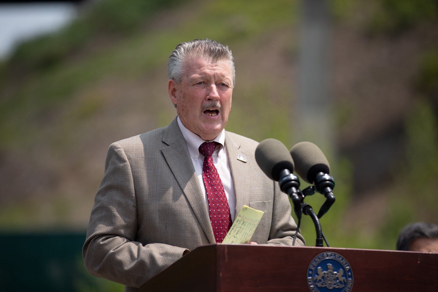 Senator Jim Brewster joined The Pennsylvania Turnpike Commission (PTC) and elected officials to break ground signifying construction is underway for the Mon/Fayette Expressway PA Route 51 to I-376 Projects southern section. Decades ago, Pennsylvania state legislators entrusted the PTC with building the Mon/Fayette Expressway (PA Turnpike 43) and in 1988 the first section of the Mon/Fayette Expressway got underway..For 35 years, the Mon Fayette Expressway has been part of the landscape leading into the Mon Valley. As funding became available, sections of the Mon/Fayette Expressway were completed creating the current 54 miles of expressway from I-68 near Morgantown, WV to Jefferson Hills Borough in Allegheny County..With the passing of Act 89 in 2013, a funding stream was made available to move ahead with the next section of the Mon/Fayette Expressway..Beyond the obvious benefits of creating a safe, reliable and open roadway for easy travel, this project and others like it also create an opportunity for development in the area, saysSen. James Brewster. Just look at how the opening of the Southern Beltway has spurred commercial and industrial development in the airport corridor with the recent announcement of the Fort Cherry Development District. Once the Mon/Fayette Expressway is finished, it will do the same for the Mon Valley..<br><a href="https://filesource.amperwave.net/commonwealthofpa/photo/22981_PTC_MonFayette_ERD_003.jpg" target="_blank">⇣ Download Photo</a>