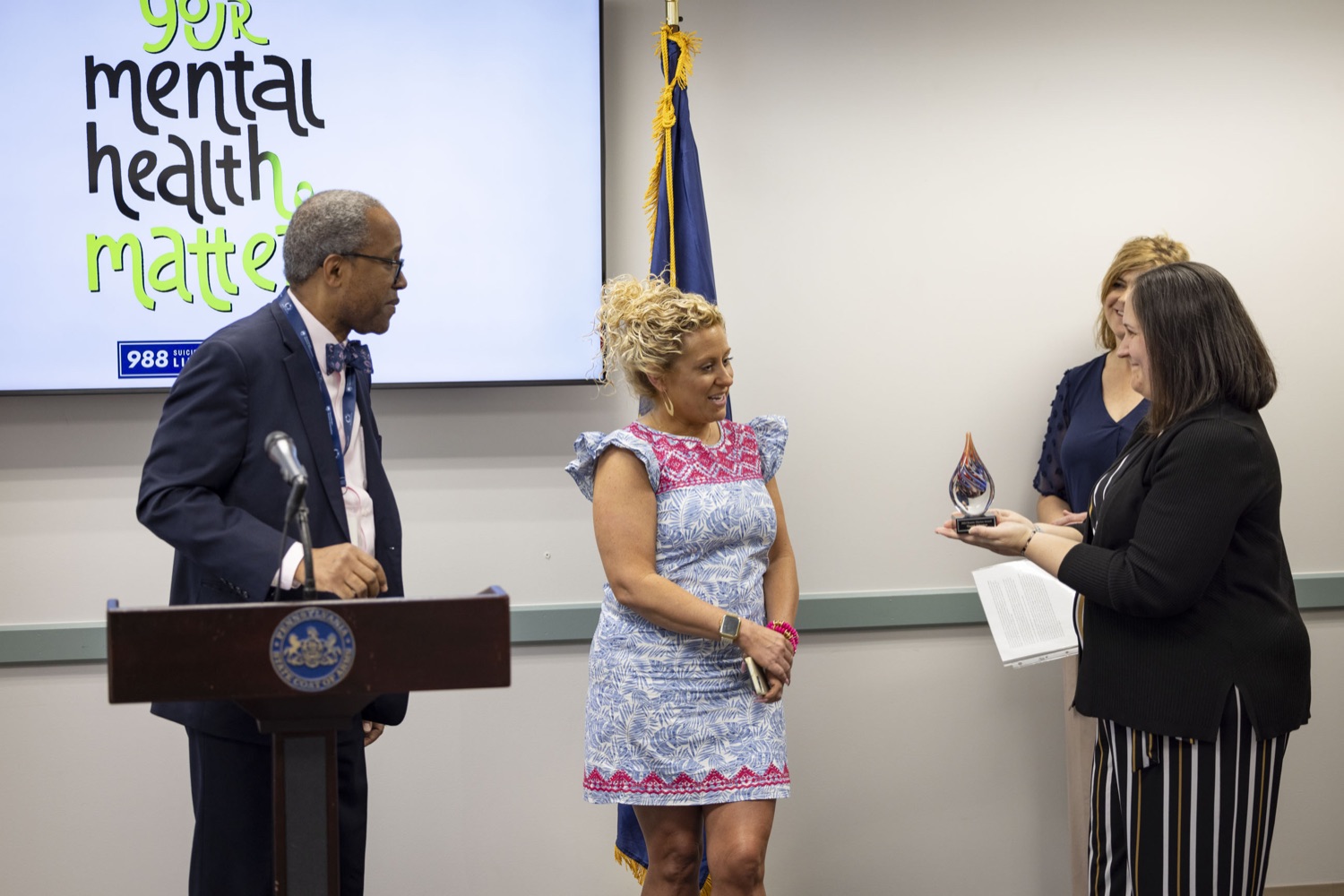 DHS Office of Mental Health and Substance Abuse Services (OMHSAS) Deputy Secretary Jen Smith presents the Dennis Marion Impact Award to Megan Johnston, Senior Human Services Program Manager with the Cumberland-Perry Mental Health Office, in Carlisle, PA on May 24, 2023.<br><a href="https://filesource.amperwave.net/commonwealthofpa/photo/23090_dhs_mentalHealth_16.jpg" target="_blank">⇣ Download Photo</a>