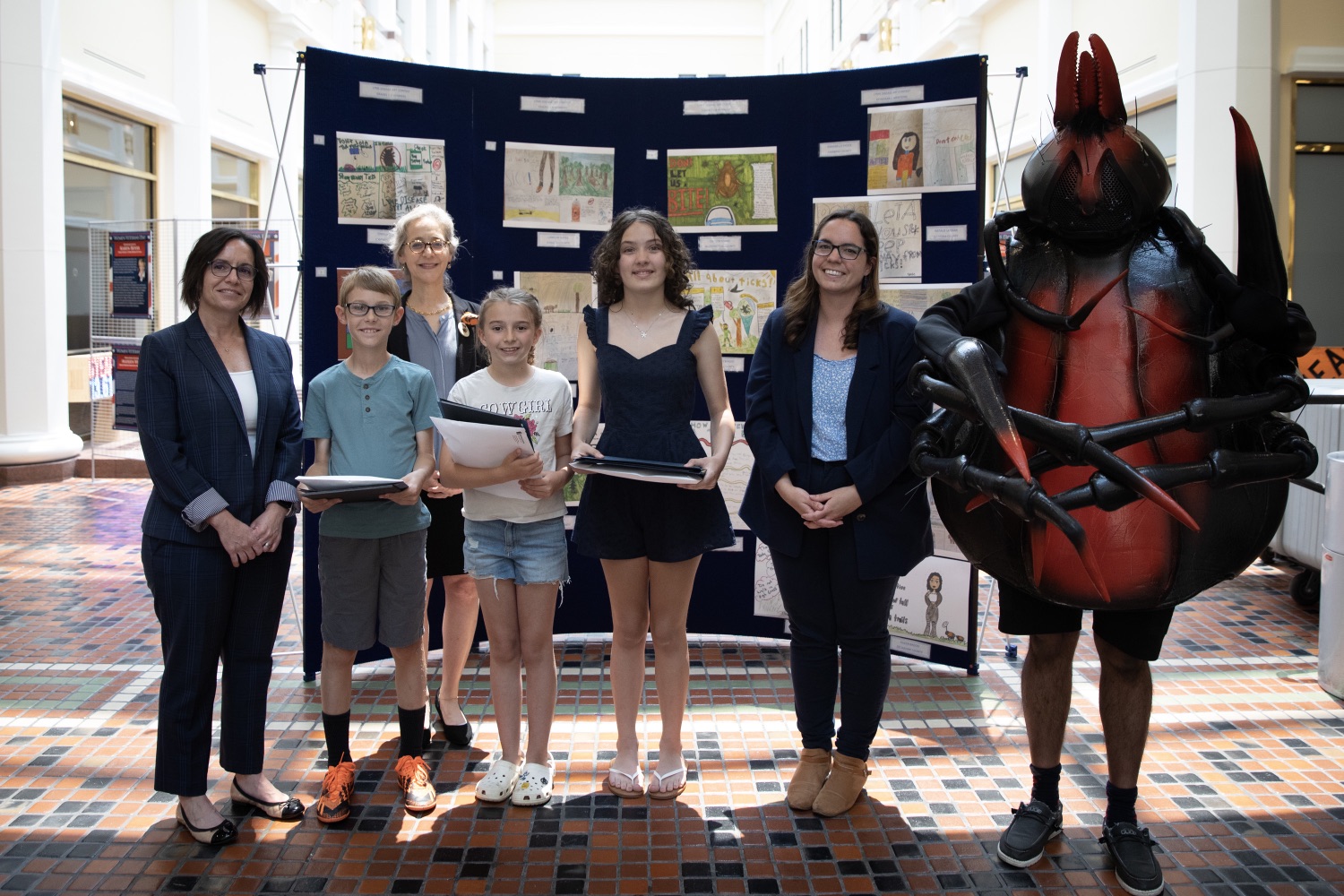 Pennsylvania Department of Healths Annual Art Competition offers an opportunity to educate students and their parents on where ticks live and how to prevent getting a tick bite and furthers our commitment to promoting healthy behaviors and preventing diseases in creative ways. This initiative serves as a consistent reminder to check yourself, your family, and your pets for ticks after spending any amount of time outdoors. On June 8, 2023, winners of the art competition were announced. Pictured here is Acting Secretary of Health, Dr. Bogen, with Leah Caltumo, 3rd place winner in the third and fourth-grade category; Caitlyn Kisner, 1st place winner in the fifth and sixth-grade category; and Landon Hayes, 1st place winner in the third and fourth-grade category. Harrisburg, Pennsylvania.<br><a href="https://filesource.amperwave.net/commonwealthofpa/photo/23159_doh_artContest_jp_10.jpg" target="_blank">⇣ Download Photo</a>