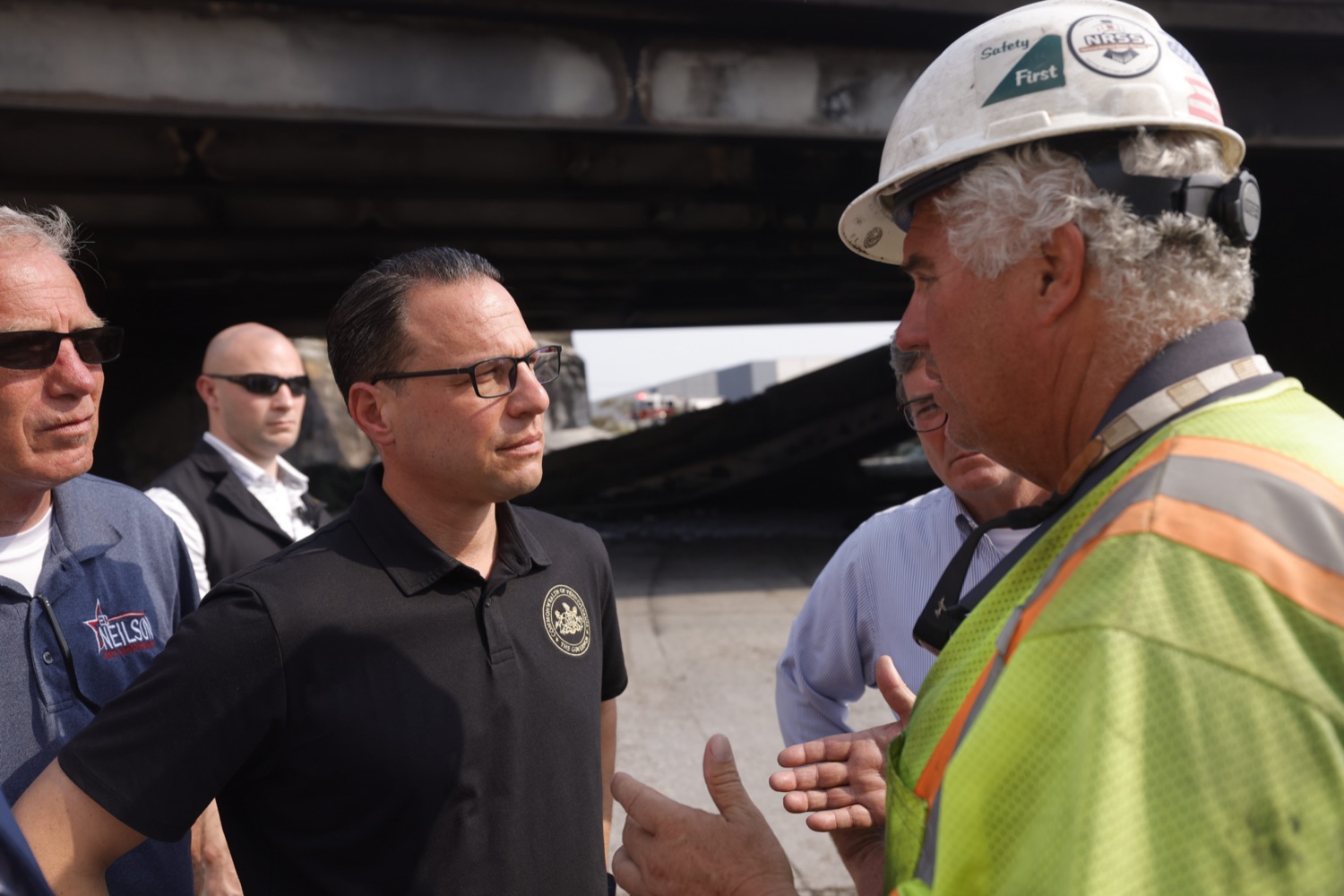 Workers at the site speak with Governor Josh Shapiro and about conditions on the ground.  Governor Josh Shapiro, along with officials from the Shapiro Administration, the City of Philadelphia, and SEPTA provided an update on the response to the vehicle fire on the Route 73/Cottman Avenue ramp under Interstate 95 in Philadelphia, which caused the roadway in this area to partially collapse, and heavily damaged the southbound structure. The interstate is closed in both directions..."Interstate 95 is a critical artery that supports our economy and plays an important role in Pennsylvanians' day to day lives. My Administration is all hands on deck to repair this safely and as efficiently as possible," said Governor Shapiro. "We will rebuild and recover - and in the meantime, we will make sure people can get to where they need to go safely."..This morning, according to first responders in Philadelphia and the Pennsylvania State Police, at approximately 6:20am, a vehicle fire under I-95 near the Cottman Avenue exit in Northeast Philadelphia caused a portion of the highway to collapse. Preliminary reports indicate a commercial truck carrying a petroleum-based product was the source of the fire. Since the crash occurred, PEMA has also been on-site, coordinating response efforts with local and federal partners.  JUNE 11, 2023 - PHILADELPHIA, PA.<br><a href="https://filesource.amperwave.net/commonwealthofpa/photo/23248_gov_I95Collapse_dz_008.JPG" target="_blank">⇣ Download Photo</a>