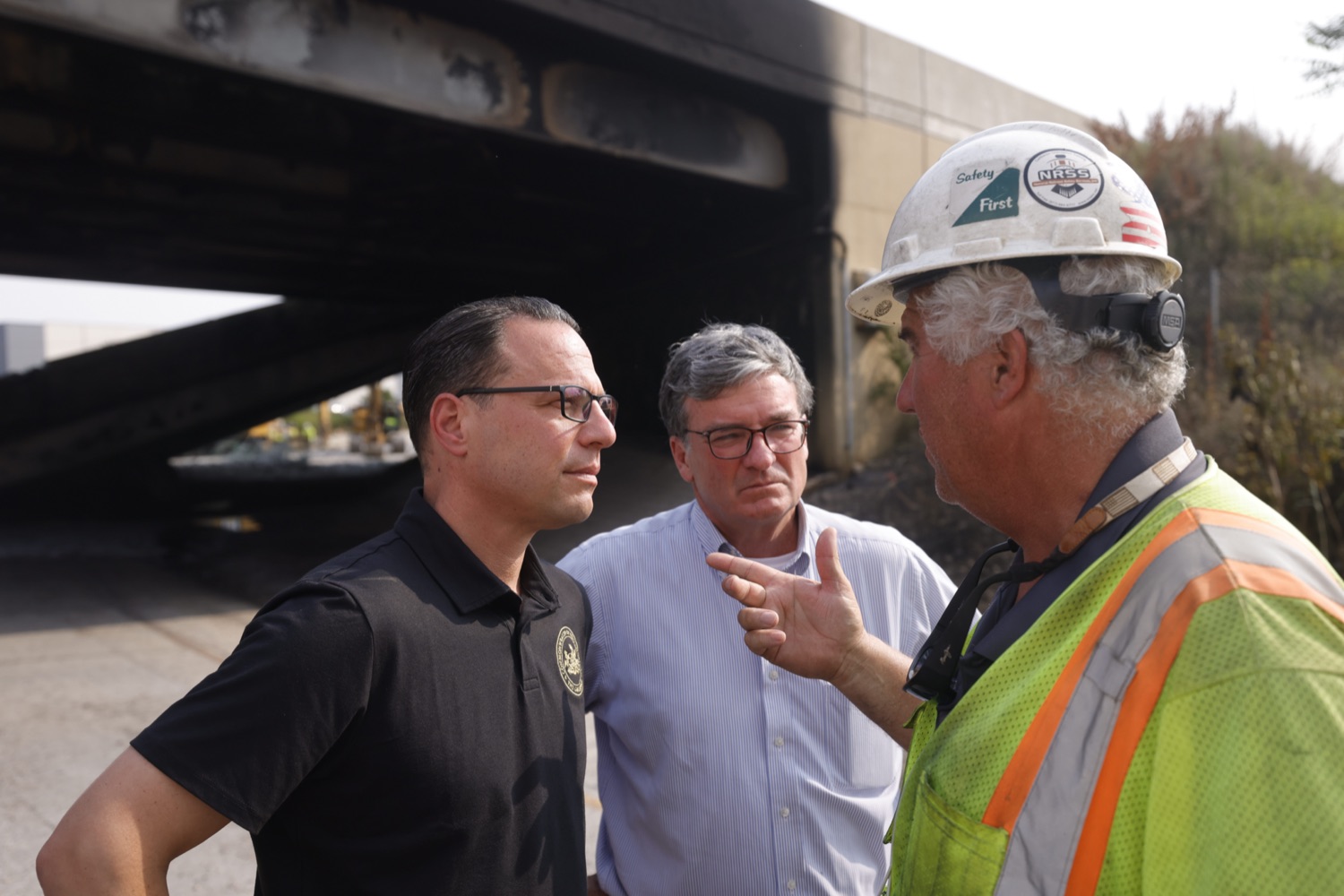 Workers at the site speak with Governor Josh Shapiro and PennDOT Secretary Mike Carroll about conditions.  Governor Josh Shapiro, along with officials from the Shapiro Administration, the City of Philadelphia, and SEPTA provided an update on the response to the vehicle fire on the Route 73/Cottman Avenue ramp under Interstate 95 in Philadelphia, which caused the roadway in this area to partially collapse, and heavily damaged the southbound structure. The interstate is closed in both directions..."Interstate 95 is a critical artery that supports our economy and plays an important role in Pennsylvanians' day to day lives. My Administration is all hands on deck to repair this safely and as efficiently as possible," said Governor Shapiro. "We will rebuild and recover - and in the meantime, we will make sure people can get to where they need to go safely."..This morning, according to first responders in Philadelphia and the Pennsylvania State Police, at approximately 6:20am, a vehicle fire under I-95 near the Cottman Avenue exit in Northeast Philadelphia caused a portion of the highway to collapse. Preliminary reports indicate a commercial truck carrying a petroleum-based product was the source of the fire. Since the crash occurred, PEMA has also been on-site, coordinating response efforts with local and federal partners.  JUNE 11, 2023 - PHILADELPHIA, PA.<br><a href="https://filesource.amperwave.net/commonwealthofpa/photo/23248_gov_I95Collapse_dz_026.JPG" target="_blank">⇣ Download Photo</a>