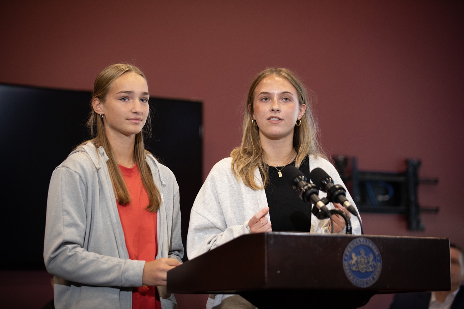The Pennsylvania Commission on Crime and Delinquency (PCCD), visited the Indiana Area School District to highlight their work with School Mental Health & Safety and Security funding provided through PCCDs School Safety and Security Committee, and to encourage schools to participate in the 2023-24 Pennsylvania Youth Survey (PAYS). Pictured here are Indiana Area High School students; Kate Lehman and Emma Massengalie; delivering remarks during the event. Harrisburg, Pennsylvania. September 15, 2023.<br><a href="https://filesource.amperwave.net/commonwealthofpa/photo/23673_pccd_indianaSD_JP_22.jpg" target="_blank">⇣ Download Photo</a>